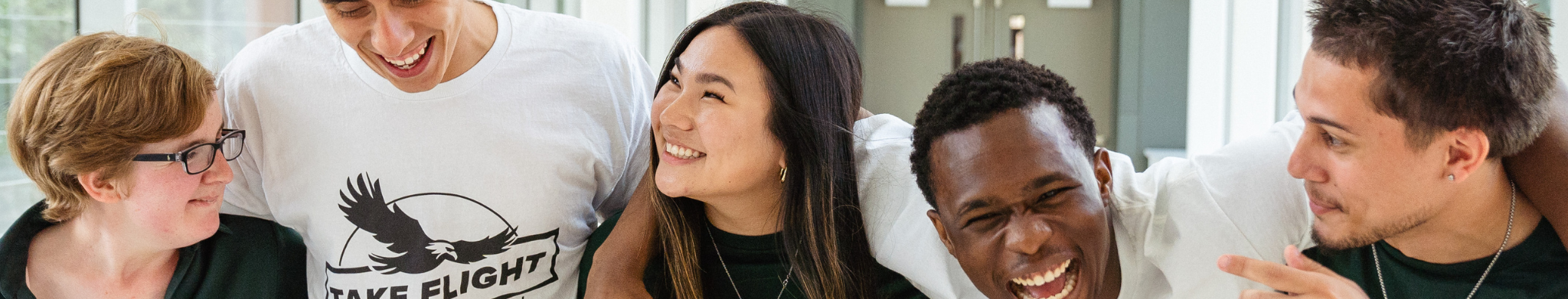 Student Smiling and Laughing in a Hallway