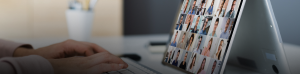 Photo of a person watching a webinar on a laptop.